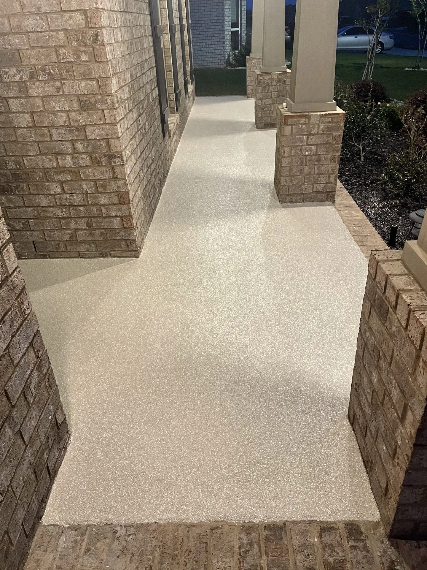 Exterior flake coating on a residential patio walkway