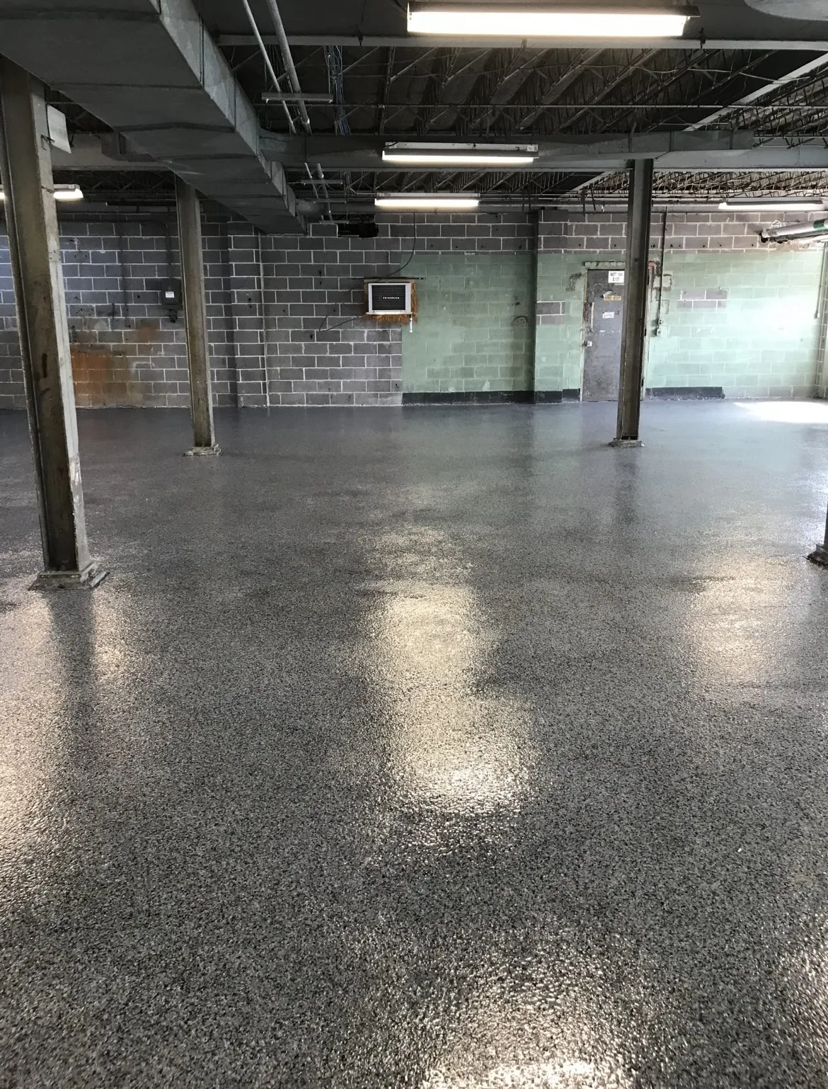 Gray flake epoxy floor coating in a commercial interior space