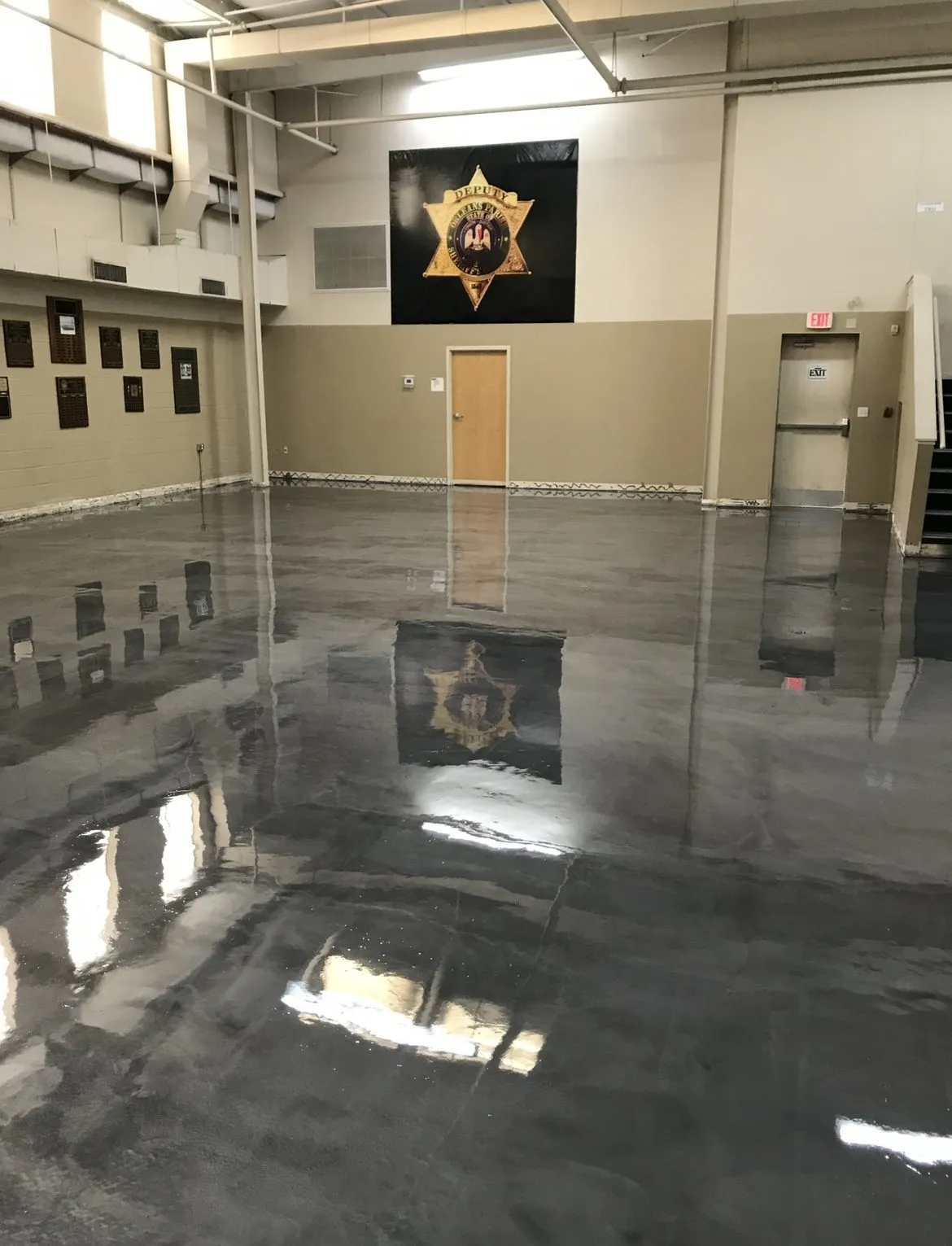 Polished dark epoxy floor installed in a community building